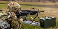 Soldier firing a M249 Squad Automatic Weapon Soldier firing a M249 Squad Automatic Weapon