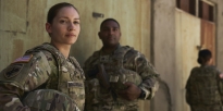 Soldiers standing outside.